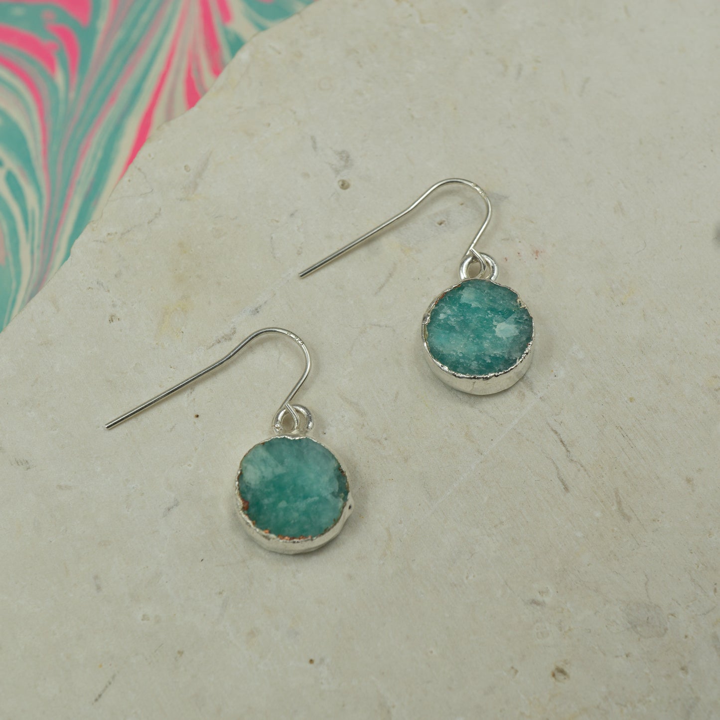 Round raw Blue amazonite earrings on hooks finished in silver.