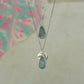 raw blue and green amazonite teardrop pear shaped pendants finished in silver on a chains.