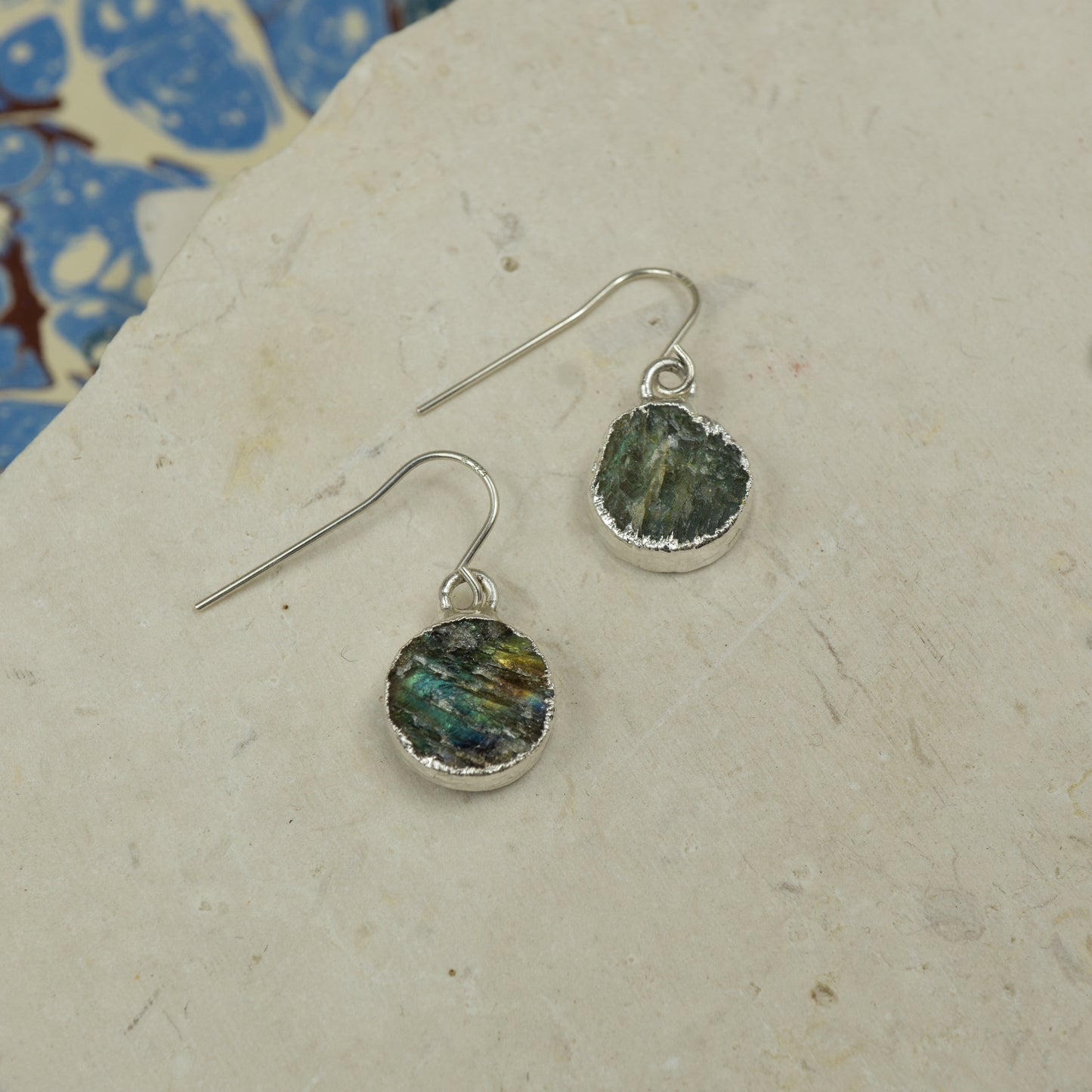 Round raw Labradorite earrings on hooks finished in silver