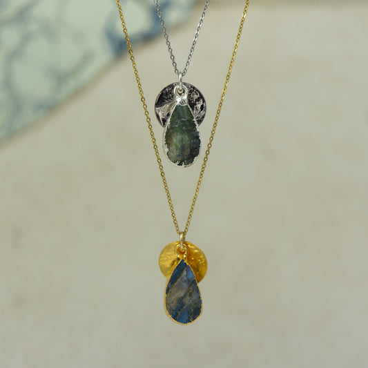 labradorite teardrop pear shaped pendant with small back disk on a chain in gold and silver