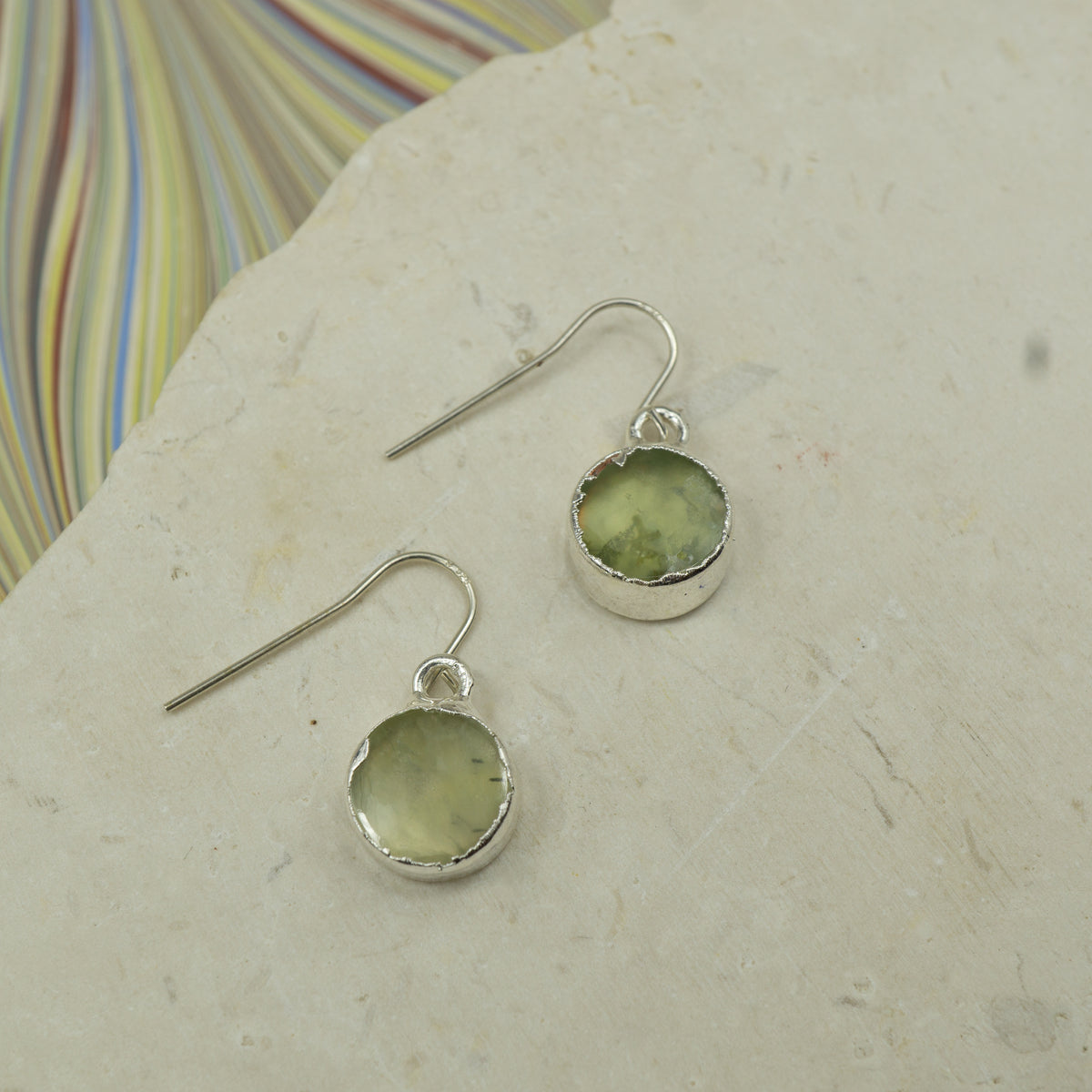 Round raw Blue amazonite earrings on hooks finished in silver