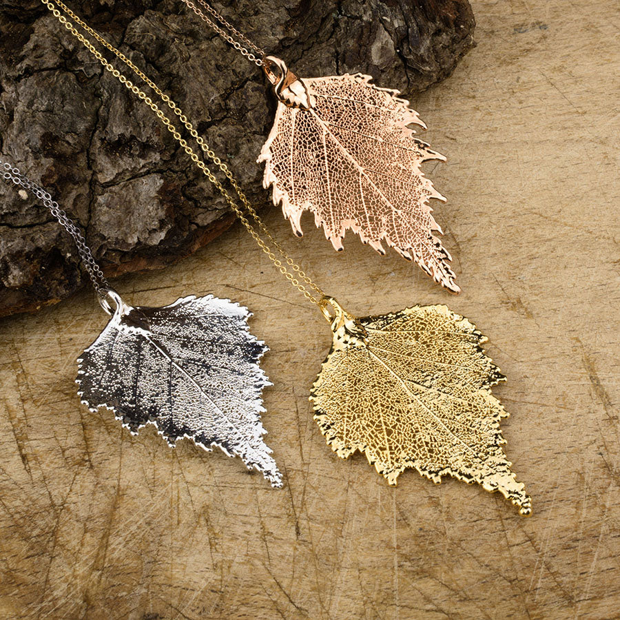 real birch leaf pendants in gold, silver and rose gold on chains