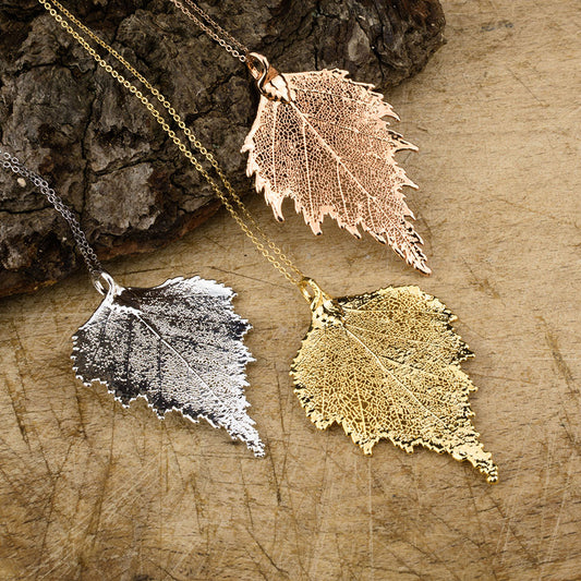 real birch leaf pendants in gold, silver and rose gold on chains