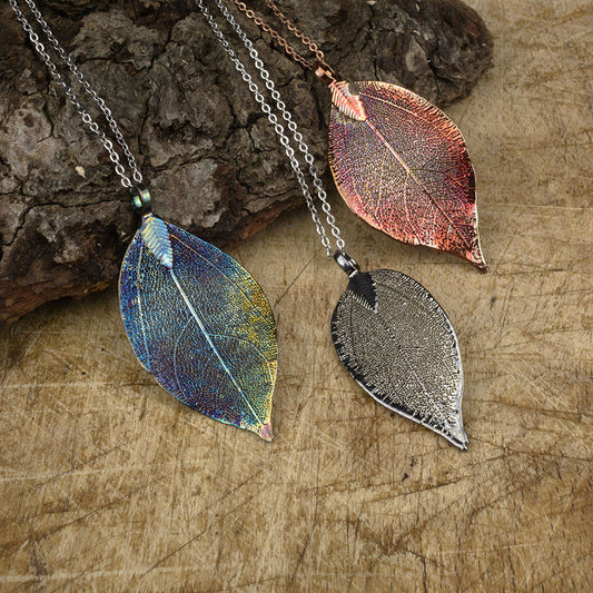 real magnolia leaf pendant in our blue and copper patinations and silver