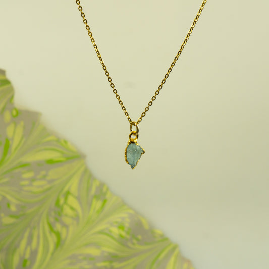 Gold necklace with a Aquamarine teardrop pendant 