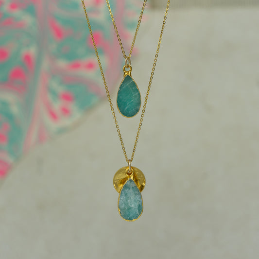 raw blue and green amazonite teardrop pear shaped pendants finished in gold on a chains.