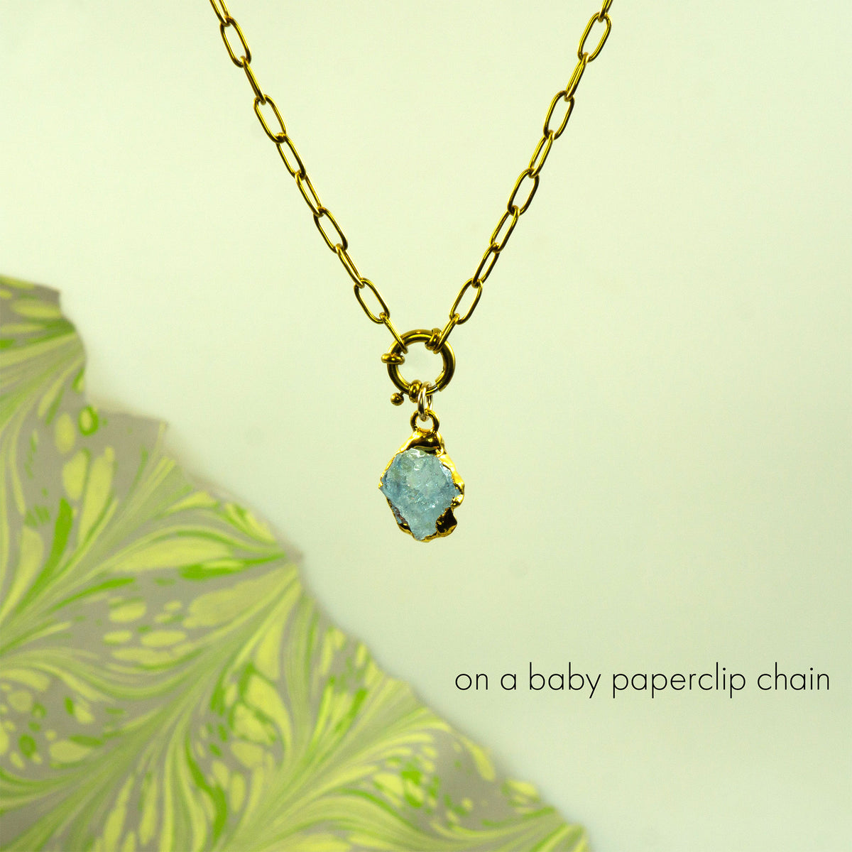 Necklace with a aquamarine pendant on a baby paperclip chain 