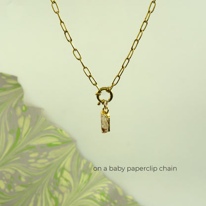 Gold baby paperclip chain necklace with a ring clasp and a rectangular Imperial Topaz gemstone pendant.