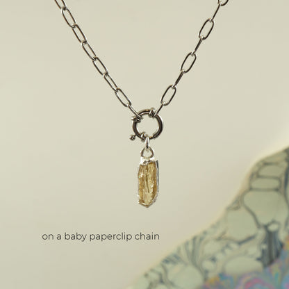 A baby paperclip silver chain necklace with a small rectangular faceted Imperial Topaz gemstone pendant.