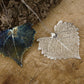 real cottonwood leaf pendant finished in silver or blue patinations.