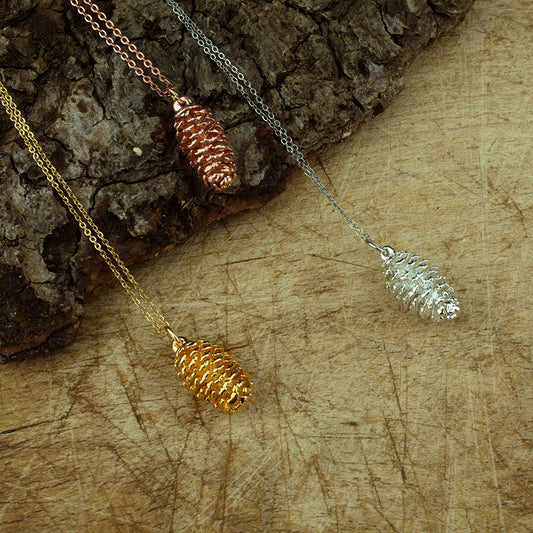real Alder cone pendants finished in Gold, Silver and rose gold on a chain