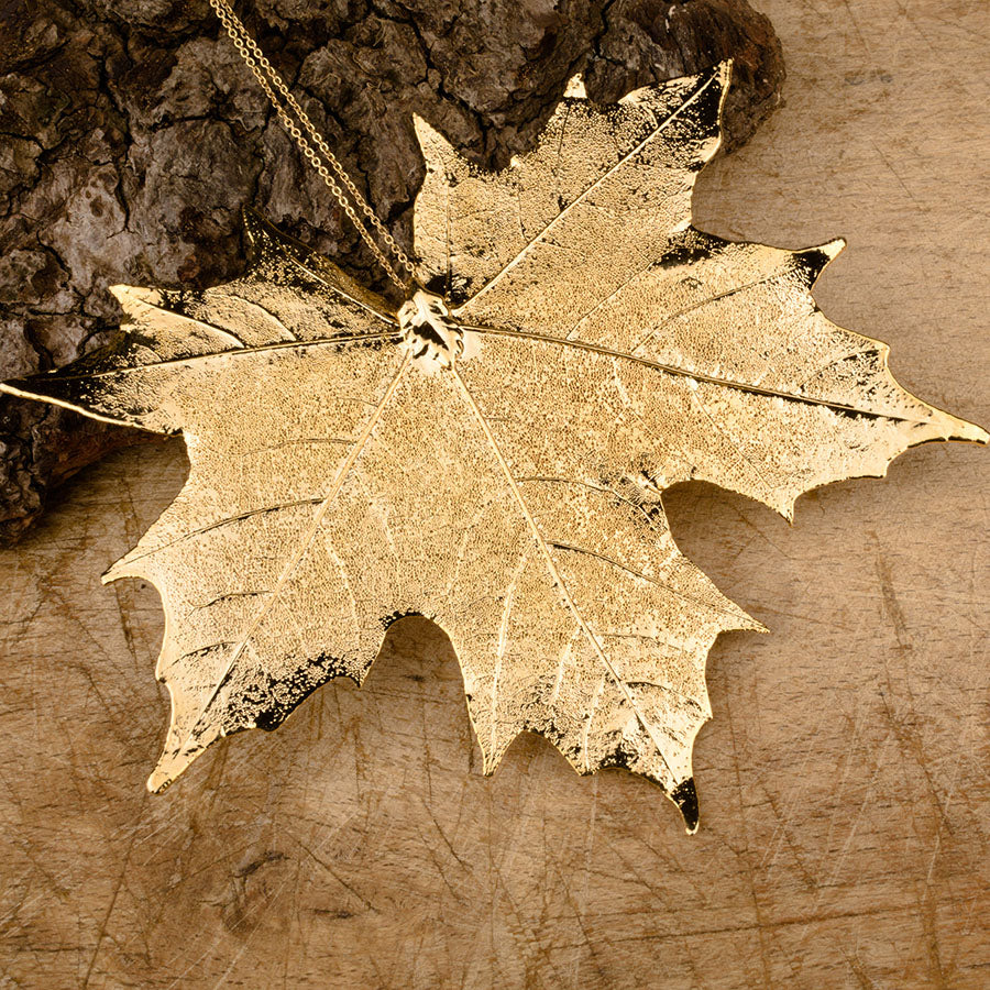 real Canadian maple leaf pendant in gold on a chain 