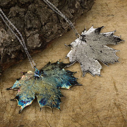 real Canadian maple leaf pendant in silver and our blue patinationn on chains