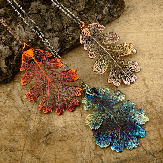 real oak leaf pendant in a copper and blue patinations.
